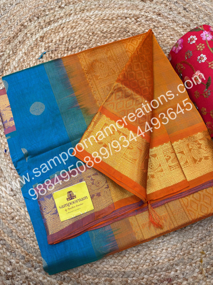 Blue with Mambazha Manjal , rich Coin Zari butta in the body , traditional  borders and rich Pallu silk cotton saree