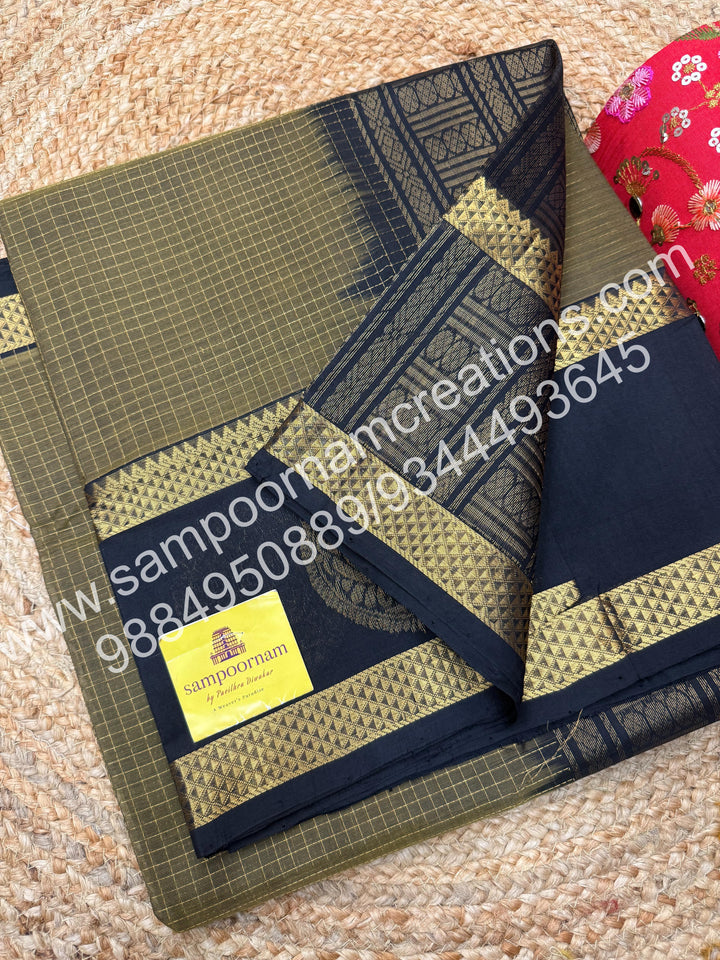 Masani green with Black  rich Zari checks in the body and Peacock motif in the  border ,rettapet borders  rich Pallu Silk Cotton Saree