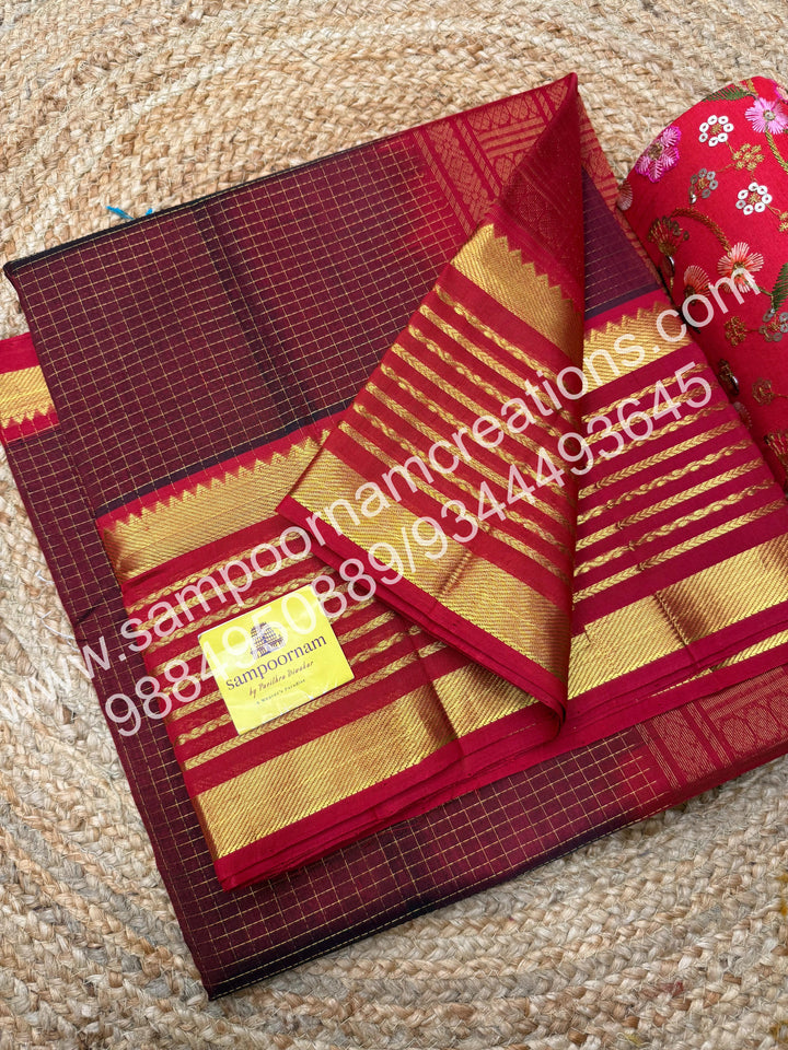 Maroon with Red , rich Zari checks in the body and traditional Veldhari  border , rich Pallu Silk Cotton Saree