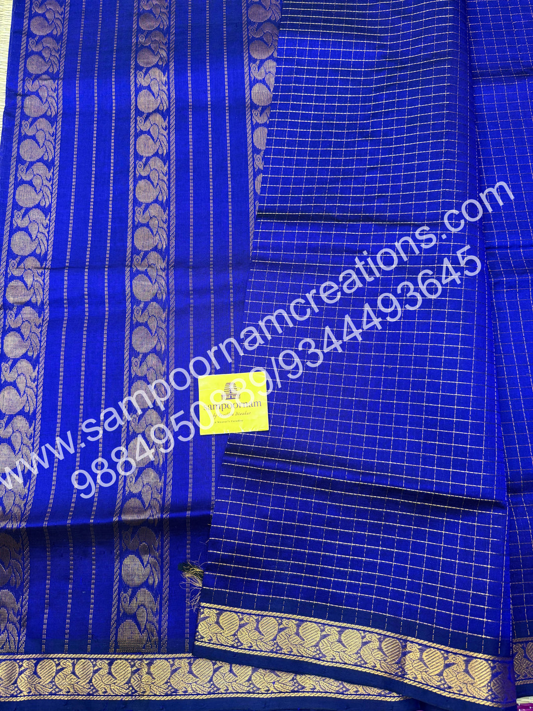 Royal Blue , rich Zari checks in the body and traditional border , rich Pallu Silk Cotton Saree