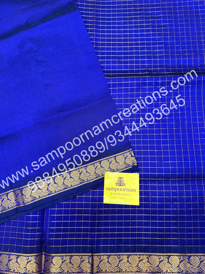 Royal Blue , rich Zari checks in the body and traditional border , rich Pallu Silk Cotton Saree
