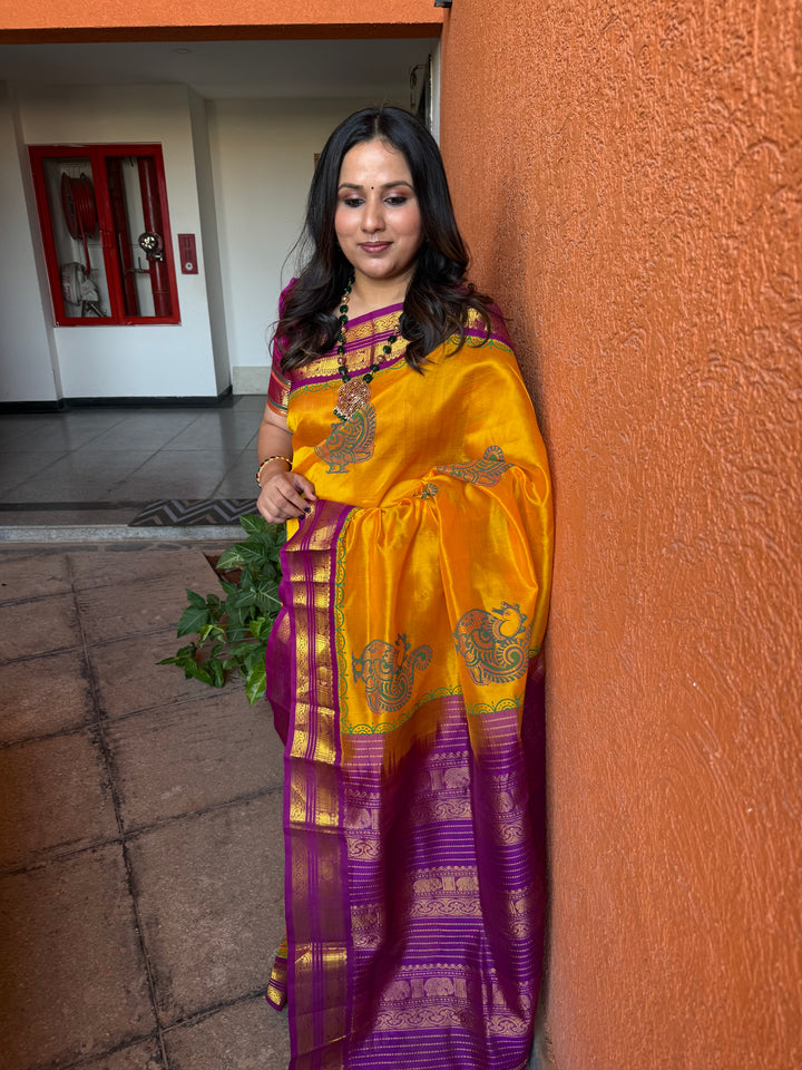 Mambazha Manjal with Purple, traditional elephant motif borders and rich Pallu, annam hand block prints in the body , korvai silk cotton saree