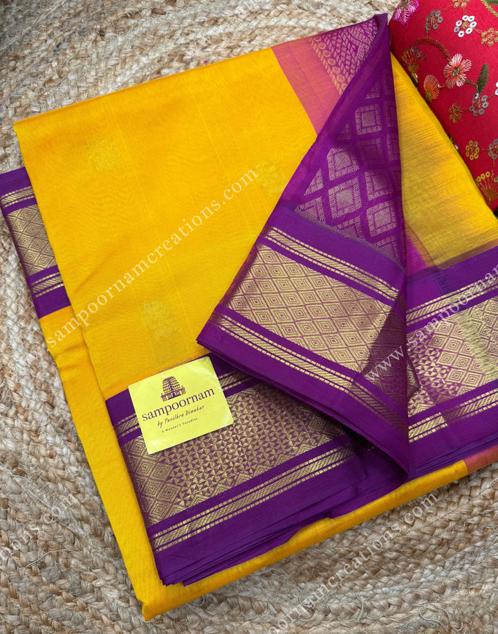 Mambazha Manjal with Deep Magenta , Rich Zari butta in the body and Traditional borders , rich Pallu Korvai Silk Cotton Sareee