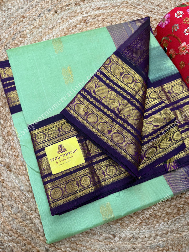 Pastel Pista Green with Vadamalli , Rich Zari butta in the body and Traditional Kanchi borders , rich Pallu Korvai Silk Cotton Sareee