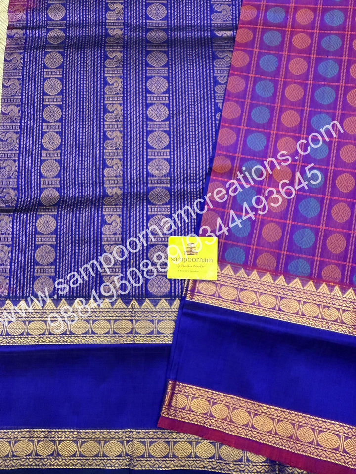 Purple with Blue , rich Rudraksh Thread butta in the body  , rettapet borders and rich Pallu silk cotton saree