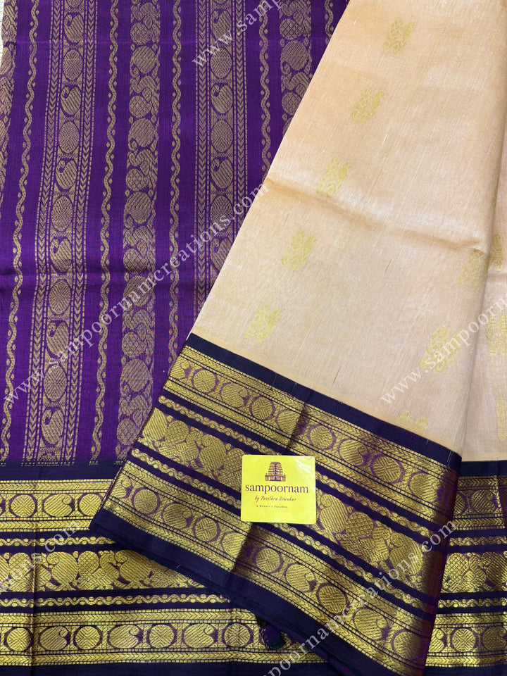 Biscuit with Purple , Rich Zari butta in the body and Traditional Kanchi borders , rich Pallu Korvai Silk Cotton Sareee