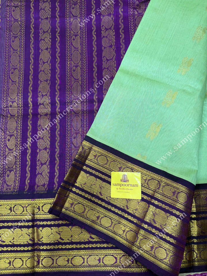 Pastel Pista Green with Vadamalli , Rich Zari butta in the body and Traditional Kanchi borders , rich Pallu Korvai Silk Cotton Sareee