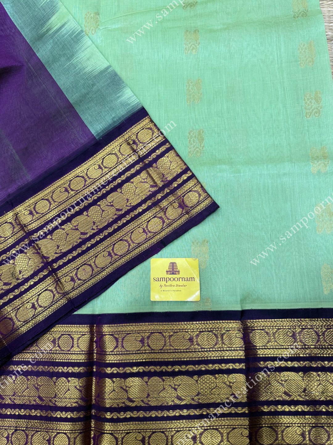 Pastel Pista Green with Vadamalli , Rich Zari butta in the body and Traditional Kanchi borders , rich Pallu Korvai Silk Cotton Sareee