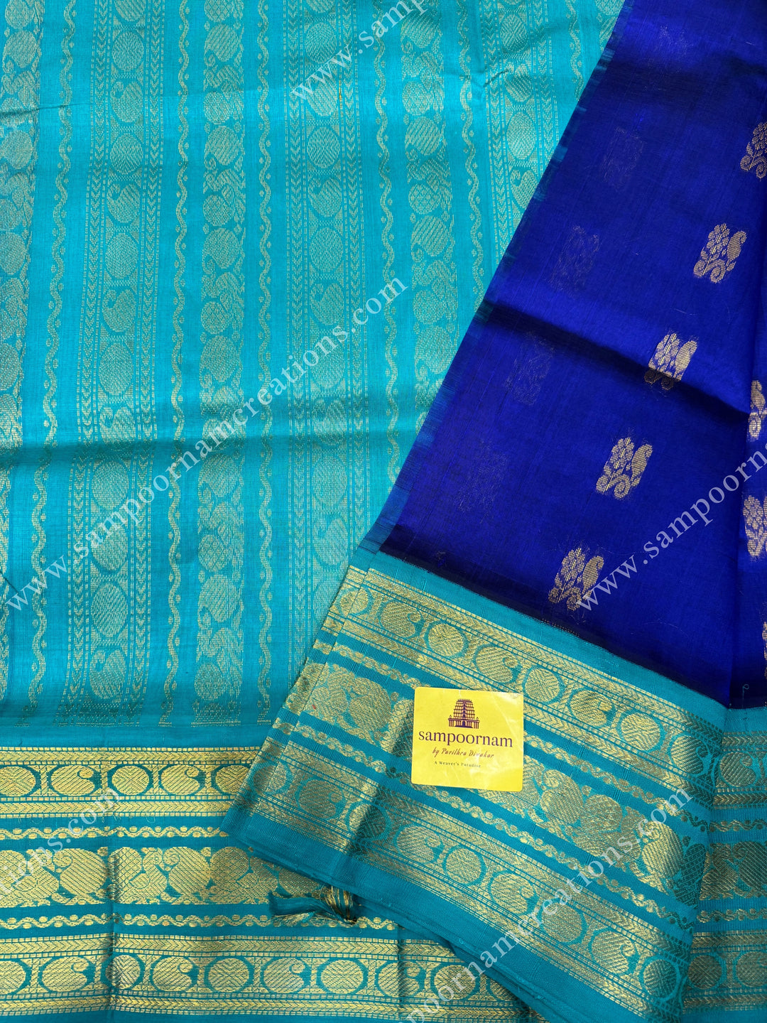 Indigo Blue with Light Blue  , Rich Zari butta in the body and Traditional Kanchi borders and  rich Pallu Korvai Silk Cotton Sareee