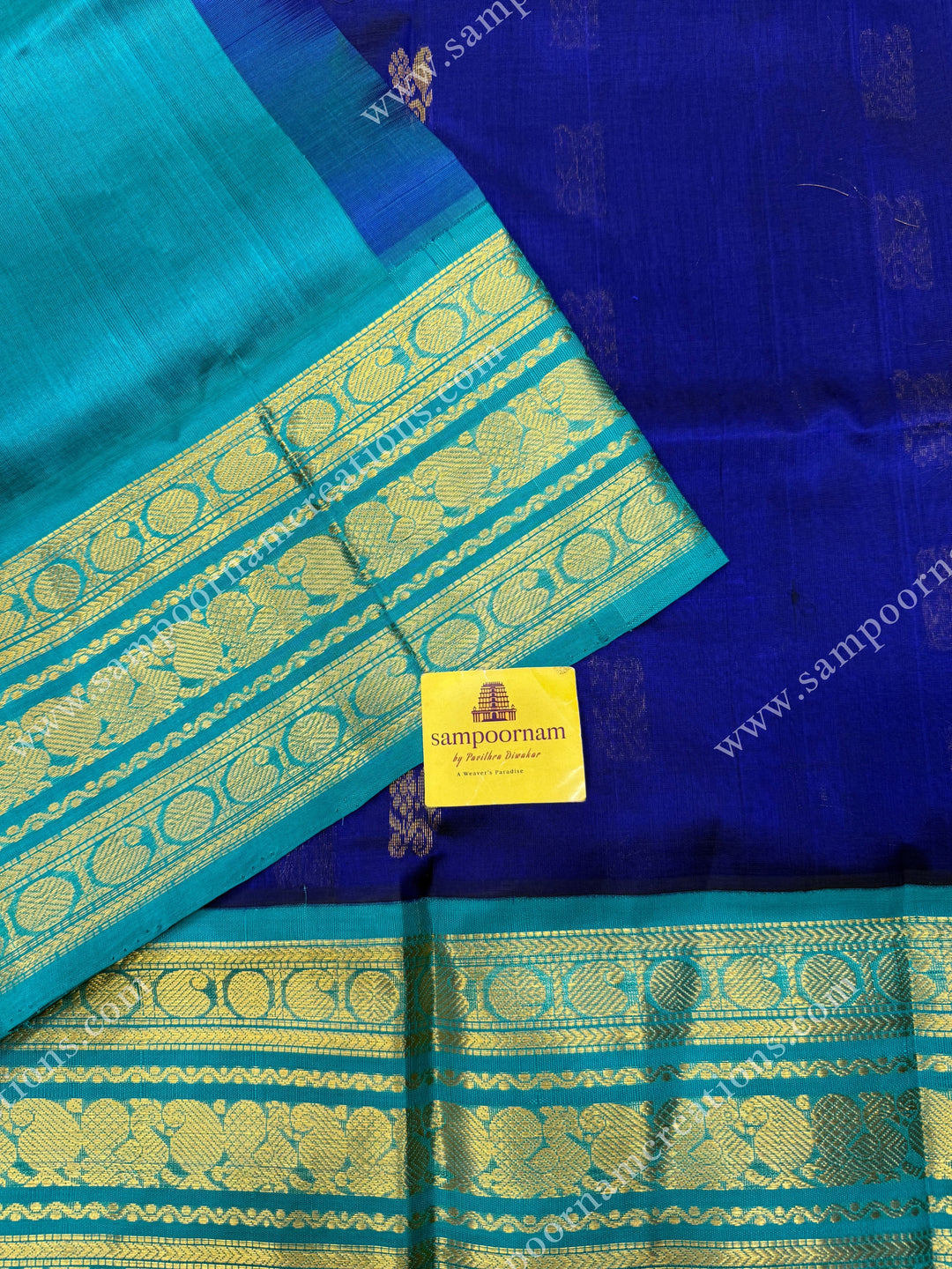 Indigo Blue with Light Blue  , Rich Zari butta in the body and Traditional Kanchi borders and  rich Pallu Korvai Silk Cotton Sareee
