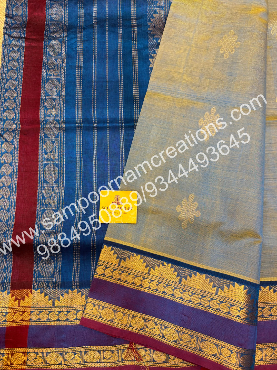 Double Shaded Ramar Green with Blue , rich Kolam Zari butta in the body , rettapet borders  and Grand Pallu Silk Cotton Saree