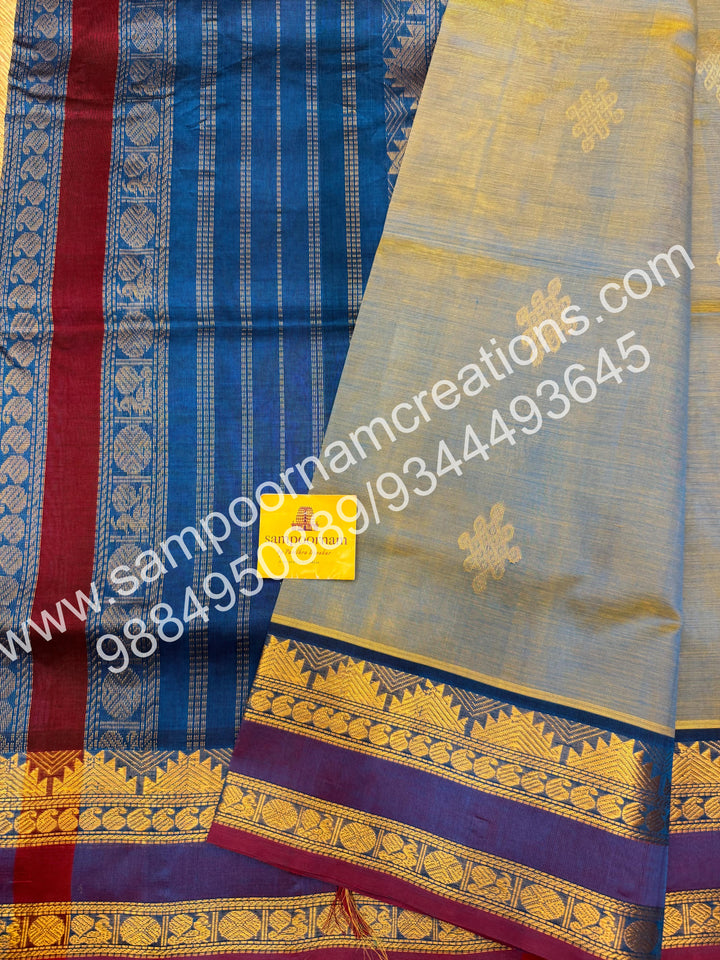 Double Shaded Ramar Green with Blue , rich Kolam Zari butta in the body , rettapet borders  and Grand Pallu Silk Cotton Saree