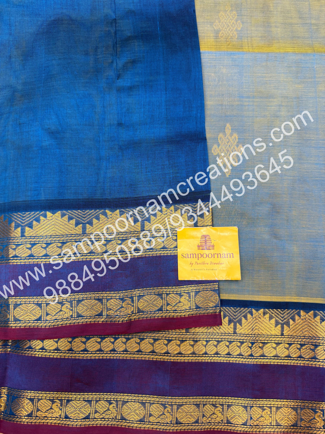 Double Shaded Ramar Green with Blue , rich Kolam Zari butta in the body , rettapet borders  and Grand Pallu Silk Cotton Saree