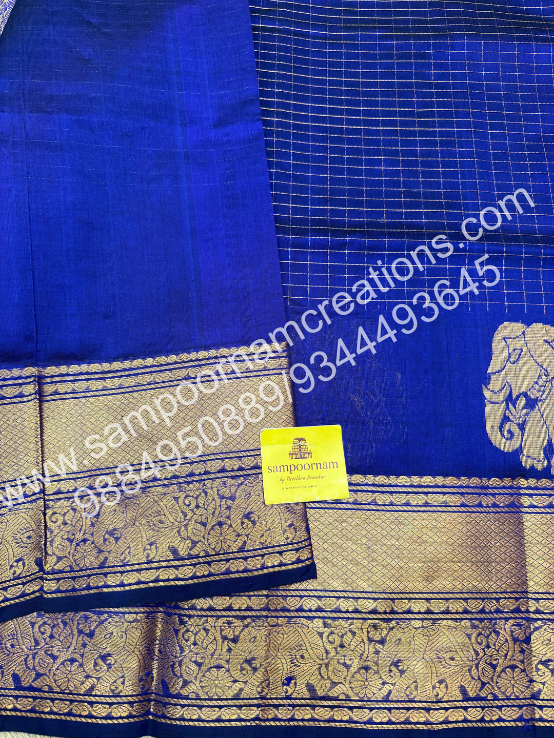 Royal Blue , Elegant Elephant zari buttu in the borders , zari checks in the body and rich Pallu Silk Cotton Saree