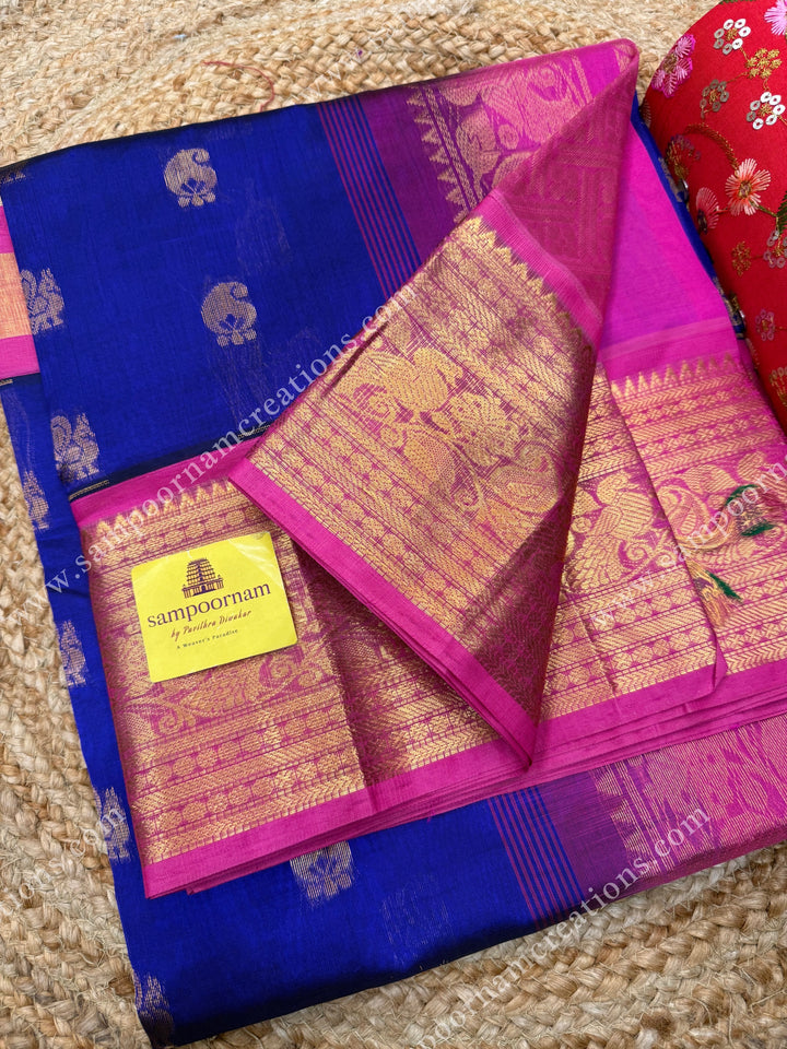 Cobalt Blue with Pink , Rich Mango and Annam  Zari butta in the body and One side long borders , rich Pallu Korvai Silk Cotton Sareee
