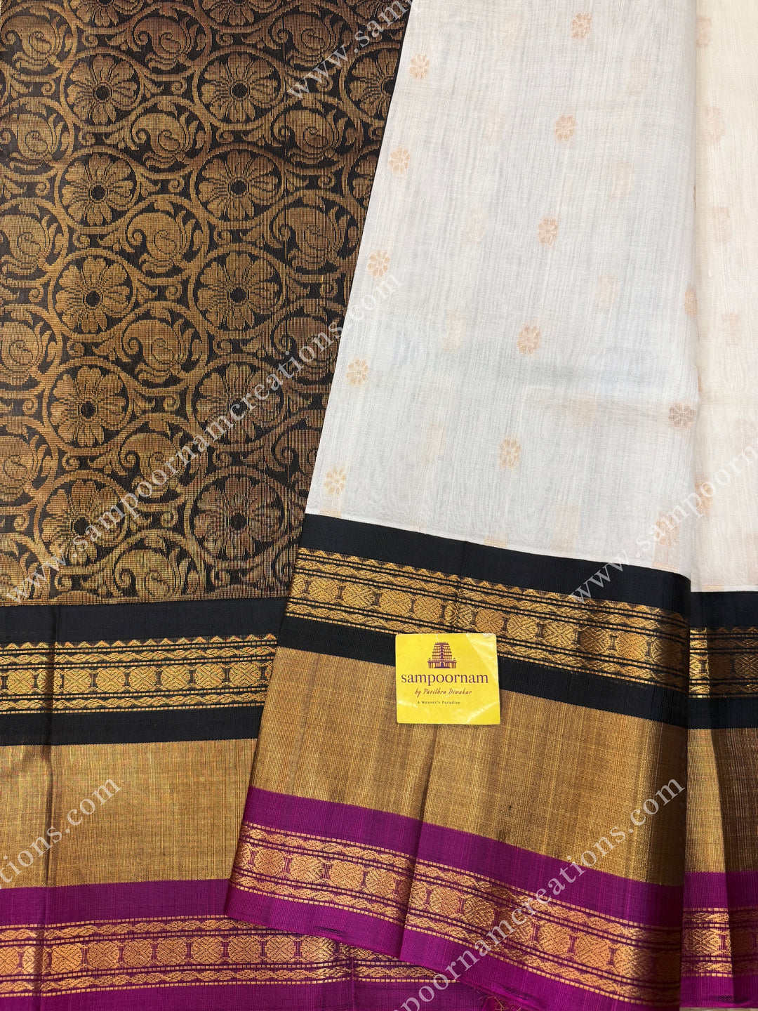 Offwhite with Black , Rich Floral Zari butta in the body and Oneside Triple  borders , rich Pallu Korvai Silk Cotton Sareee