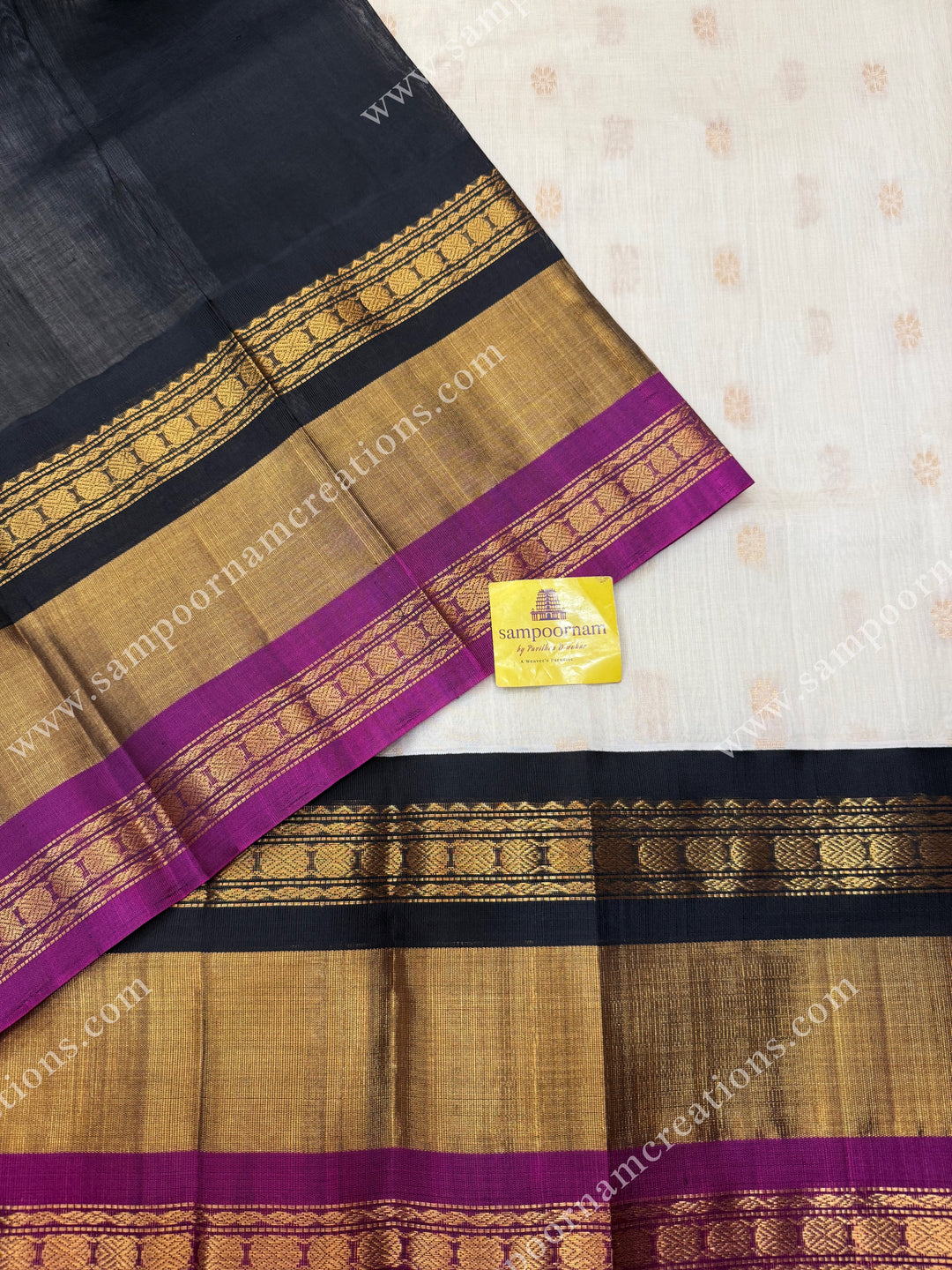 Offwhite with Black , Rich Floral Zari butta in the body and Oneside Triple  borders , rich Pallu Korvai Silk Cotton Sareee