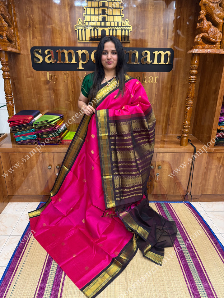 Dark Pink with Deep Brown , Rich Zari butta in the body and Traditional  borders , rich Pallu Korvai Silk Cotton Sareee