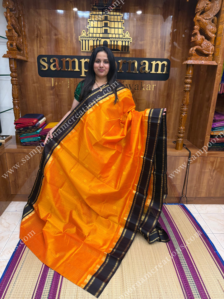 Mambazha Manjal with Deep Brown , Zari checks and Annam butta in the body  ,  Rettapetborders and rich Pallu Korvai Silk Cotton Sareee