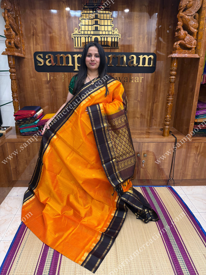 Mambazha Manjal with Deep Brown , Zari checks and Annam butta in the body  ,  Rettapetborders and rich Pallu Korvai Silk Cotton Sareee