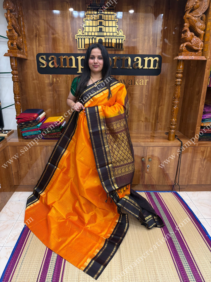 Mambazha Manjal with Deep Brown , Zari checks and Annam butta in the body  ,  Rettapetborders and rich Pallu Korvai Silk Cotton Sareee
