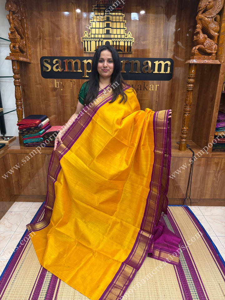Mambazha Manjal with Deep Magenta , Rich Zari butta in the body and Traditional borders , rich Pallu Korvai Silk Cotton Sareee