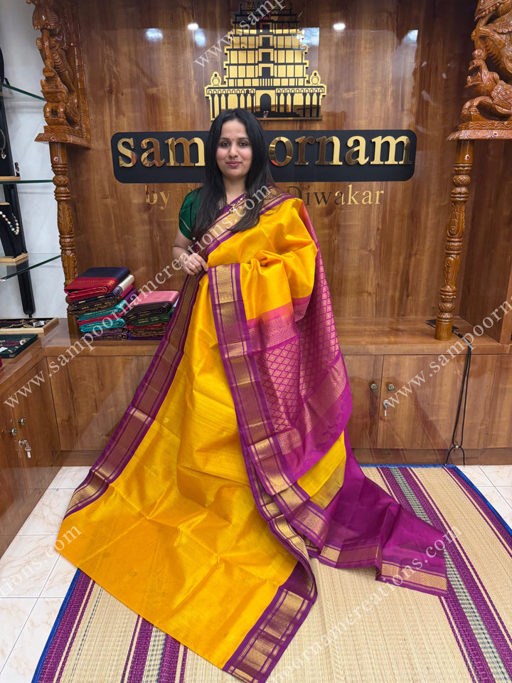 Mambazha Manjal with Deep Magenta , Rich Zari butta in the body and Traditional borders , rich Pallu Korvai Silk Cotton Sareee