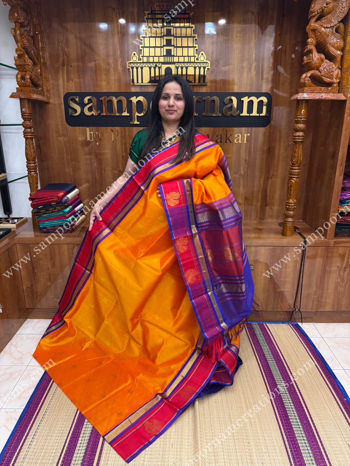 Mambazha Manjal with Royal Blue ,  Zari Butta in the body and  Traditional Annam Motifs in the border , rich Pallu Korvai Silk Cotton Sareee