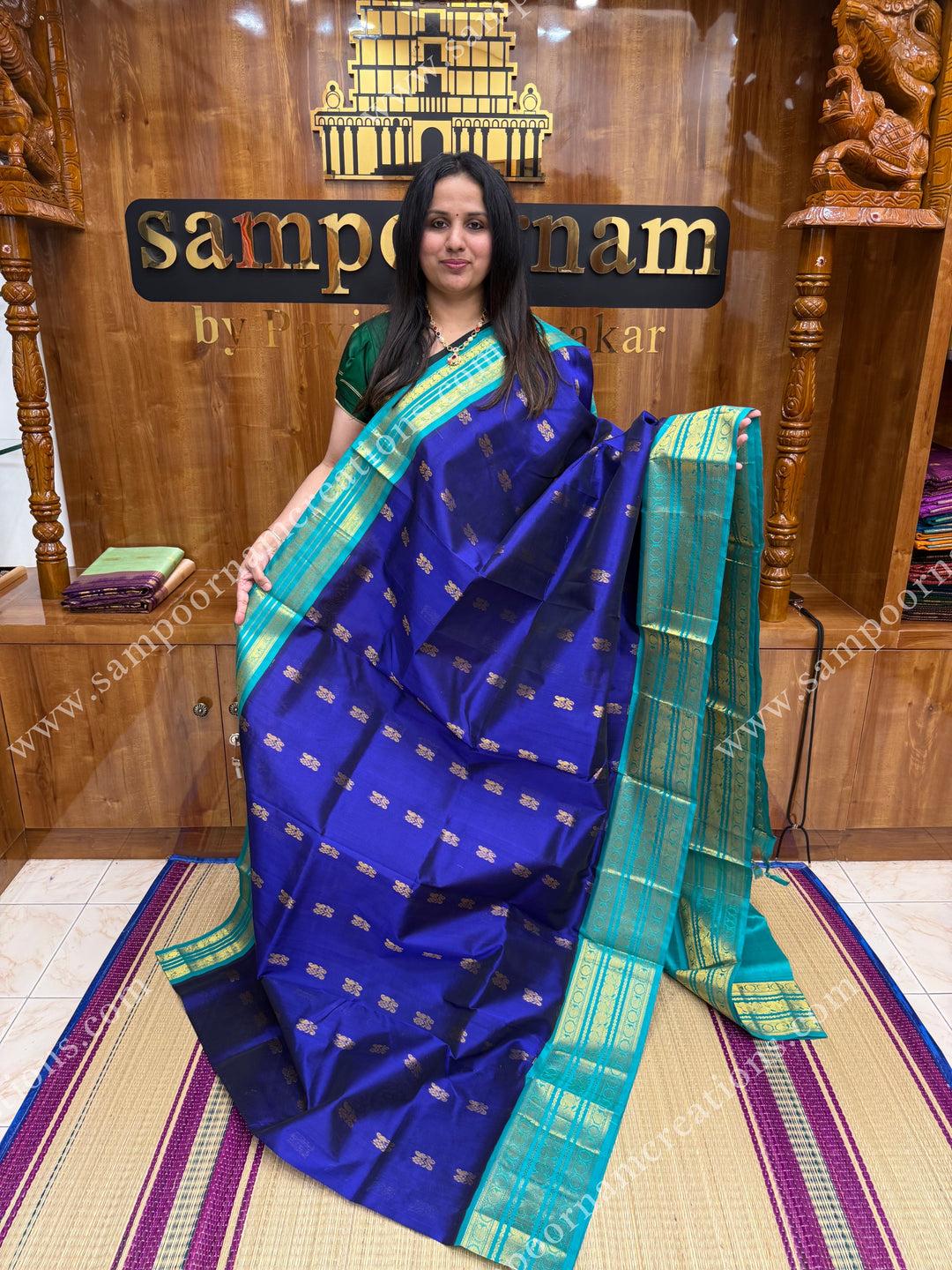 Indigo Blue with Light Blue  , Rich Zari butta in the body and Traditional Kanchi borders and  rich Pallu Korvai Silk Cotton Sareee