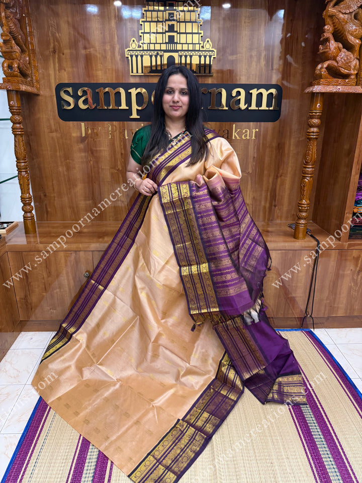 Biscuit with Purple , Rich Zari butta in the body and Traditional Kanchi borders , rich Pallu Korvai Silk Cotton Sareee