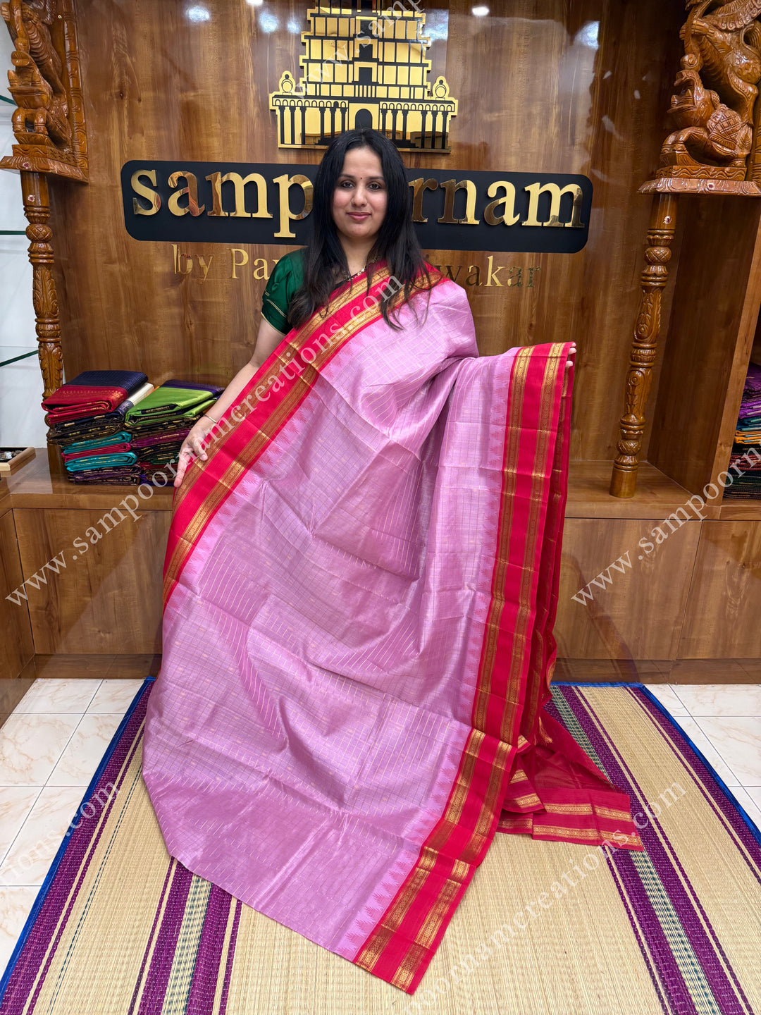 Pastel Pink with Red , Rich Zari checks and Butta in the body and  rettapet  borders , rich Pallu Korvai Silk Cotton Sareee