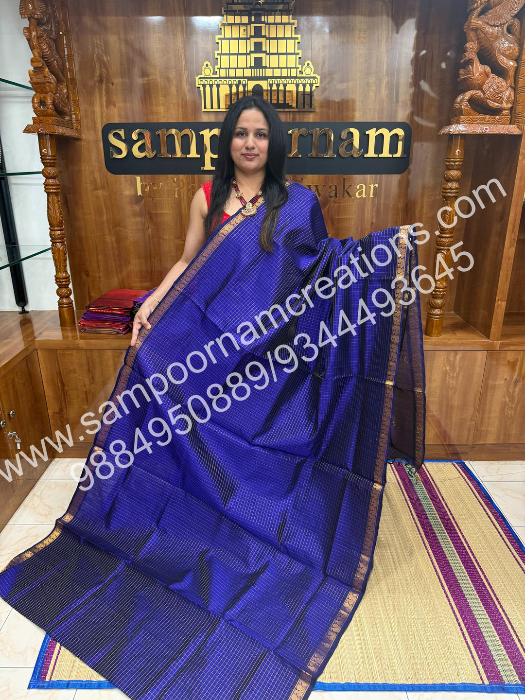 Royal Blue , rich Zari checks in the body and traditional border , rich Pallu Silk Cotton Saree