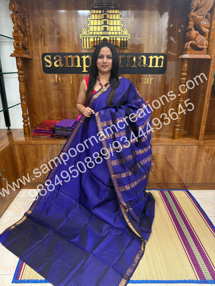 Royal Blue , rich Zari checks in the body and traditional border , rich Pallu Silk Cotton Saree