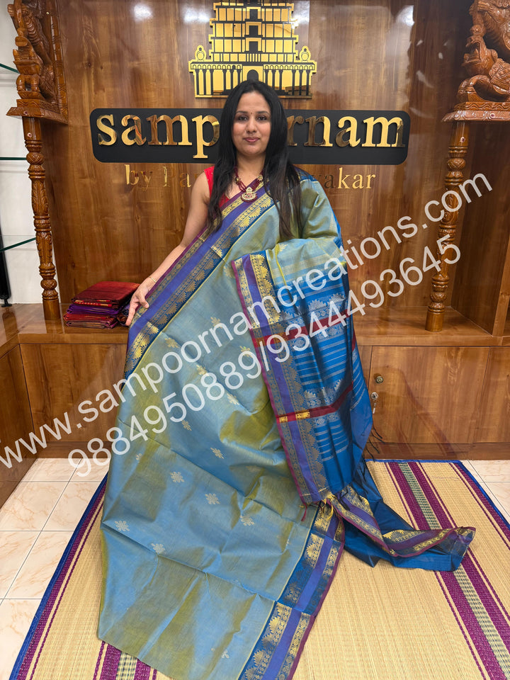 Double Shaded Ramar Green with Blue , rich Kolam Zari butta in the body , rettapet borders  and Grand Pallu Silk Cotton Saree