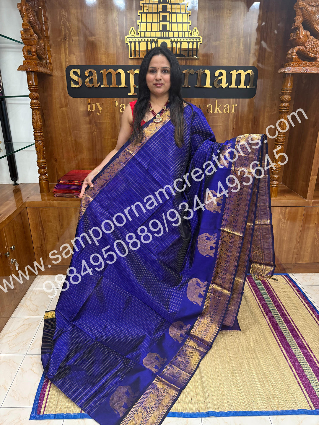 Indigo blue  Elegant Elephant zari buttu in the borders , zari checks in the body and rich Pallu Silk Cotton Saree