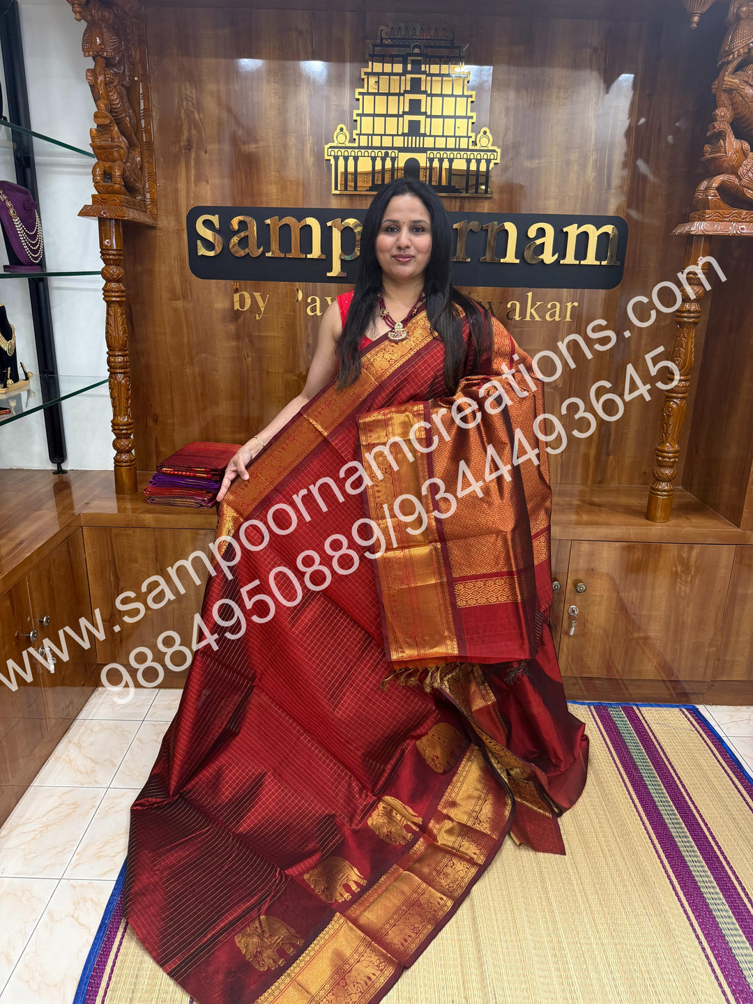 Maroon  Elegant Elephant zari buttu in the borders , zari checks in the body and rich Pallu Silk Cotton Saree