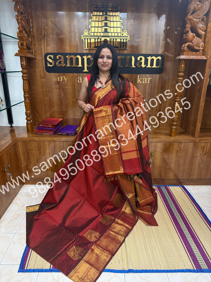 Maroon  Elegant Elephant zari buttu in the borders , zari checks in the body and rich Pallu Silk Cotton Saree