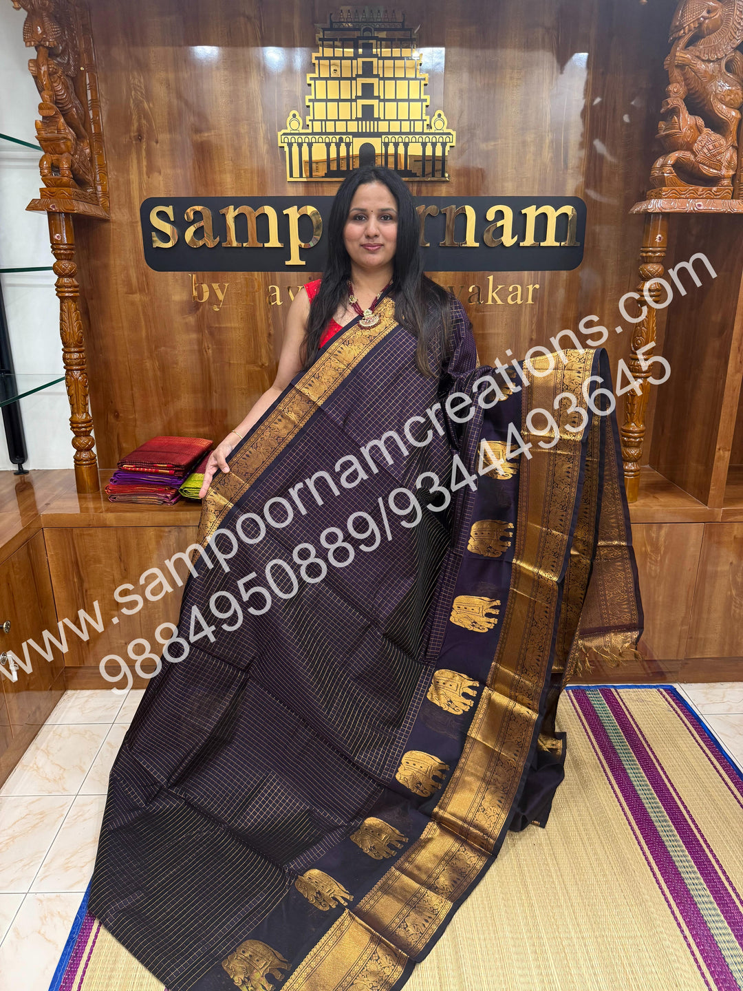 Dark Wine  Elegant Elephant zari buttu in the borders , zari checks in the body and rich Pallu Silk Cotton Saree