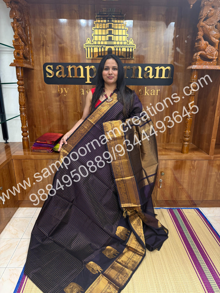 Dark Wine  Elegant Elephant zari buttu in the borders , zari checks in the body and rich Pallu Silk Cotton Saree