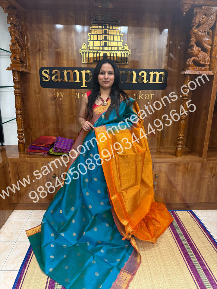 Blue with Mambazha Manjal , rich Coin Zari butta in the body , traditional  borders and rich Pallu silk cotton saree