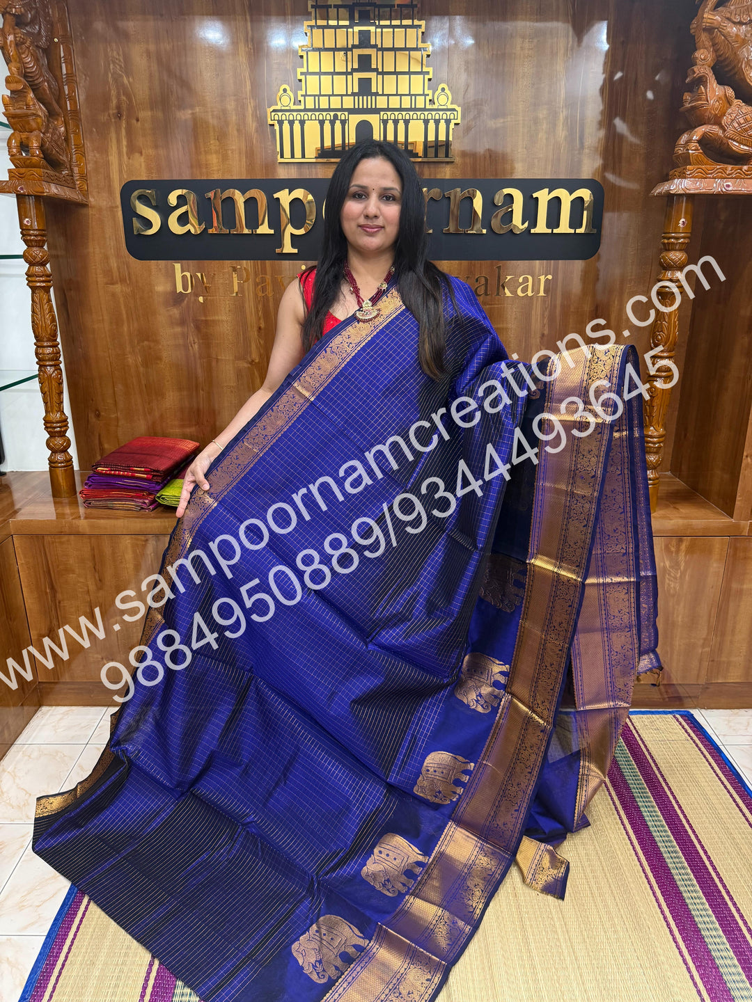 Royal Blue , Elegant Elephant zari buttu in the borders , zari checks in the body and rich Pallu Silk Cotton Saree