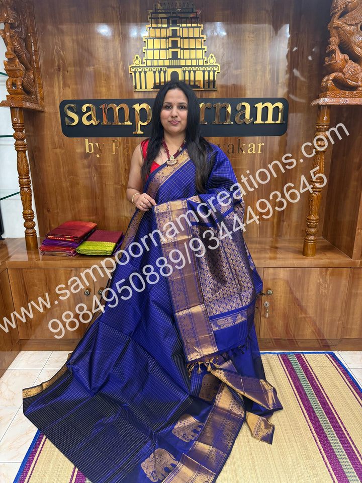 Royal Blue , Elegant Elephant zari buttu in the borders , zari checks in the body and rich Pallu Silk Cotton Saree