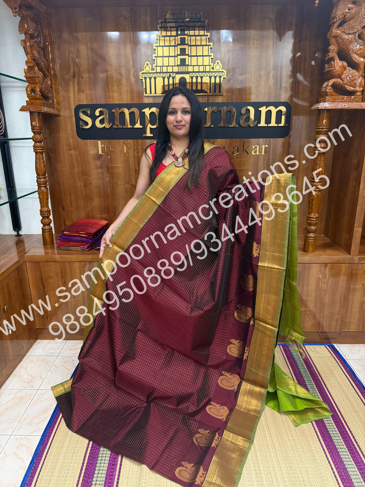 Brown with Green , Annam Motif zari buttu in the borders , zari checks in the body and rich Pallu Silk Cotton Saree