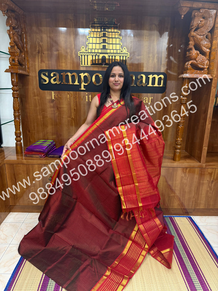 Maroon with Red , rich Zari checks in the body and traditional Veldhari  border , rich Pallu Silk Cotton Saree