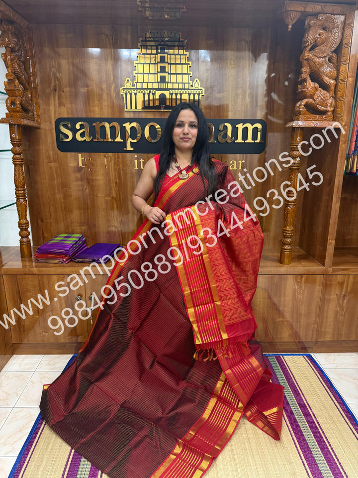 Maroon with Red , rich Zari checks in the body and traditional Veldhari  border , rich Pallu Silk Cotton Saree