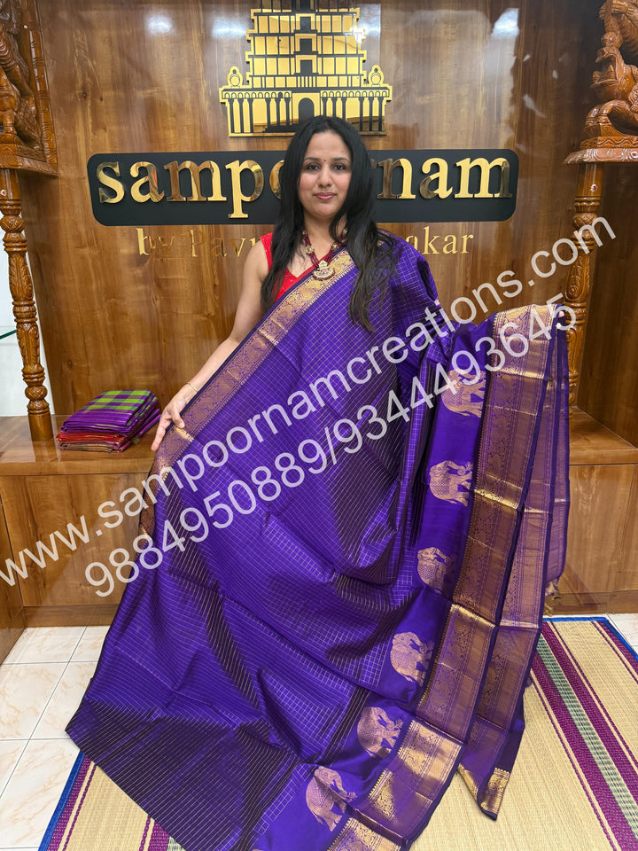 Violet Elegant Elephant zari buttu in the borders , zari checks in the body and rich Pallu Silk Cotton Saree