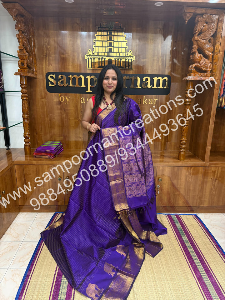 Violet Elegant Elephant zari buttu in the borders , zari checks in the body and rich Pallu Silk Cotton Saree