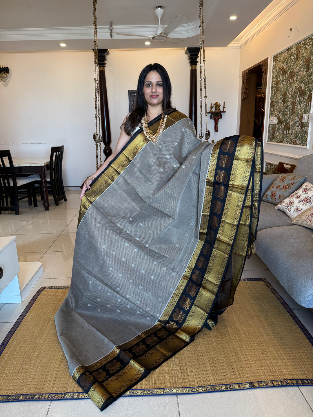 Grey with Black zari podi kattam in the body,satin border with annam motif, rich border and pallu korvai silk  cotton saree