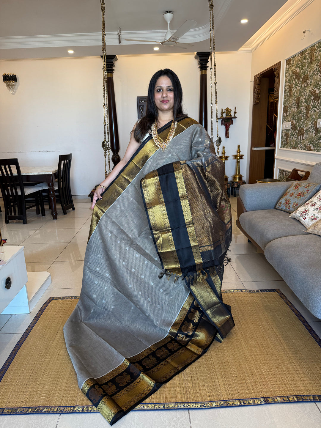 Grey with Black zari podi kattam in the body,satin border with annam motif, rich border and pallu korvai silk  cotton saree
