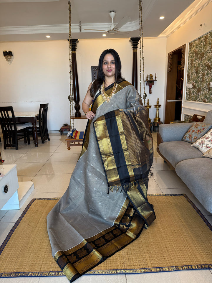 Grey with Black zari podi kattam in the body,satin border with annam motif, rich border and pallu korvai silk  cotton saree